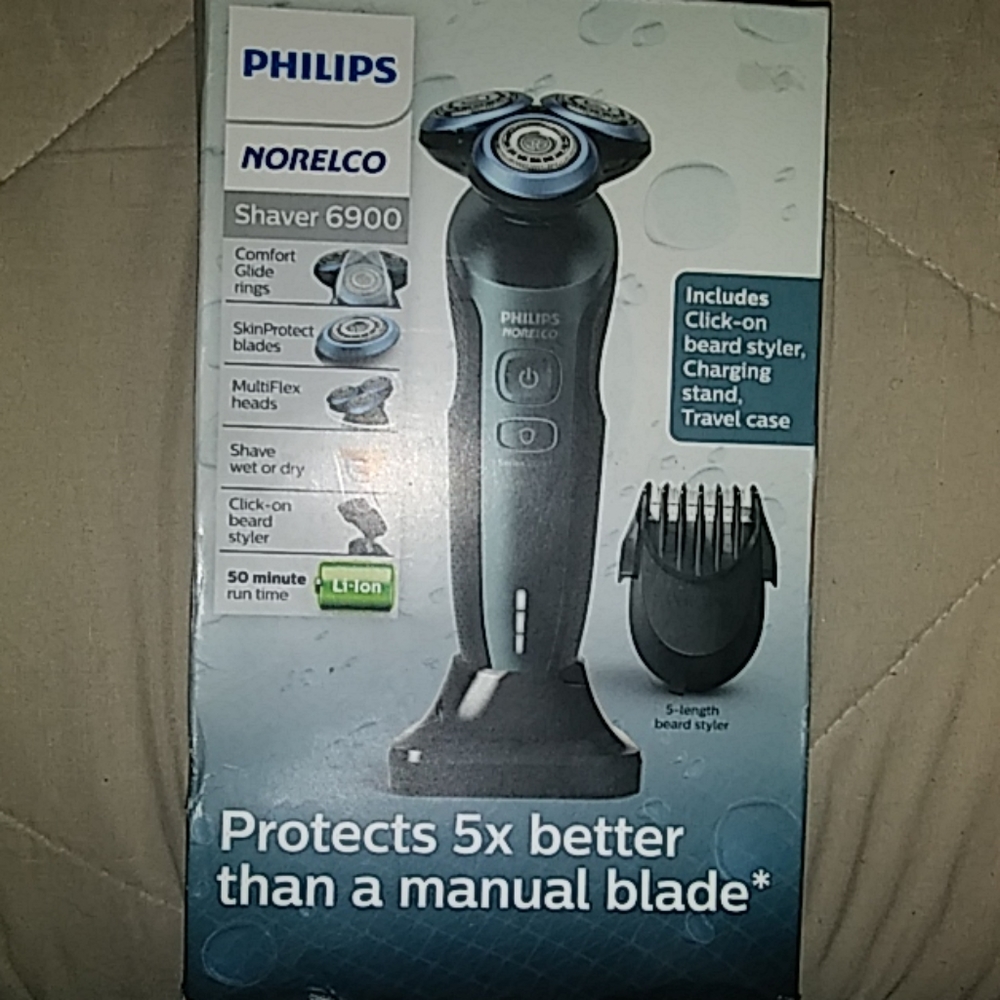 Brand new never opened Norelco electric shaver.